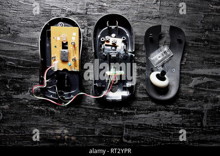 Broken Computer Mouse on Black Background Stock Photo