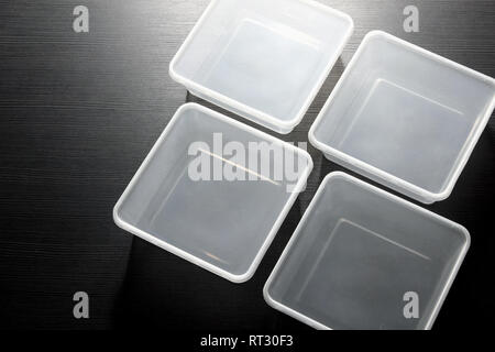 Plastic Containers on Wooden Blackground Stock Photo