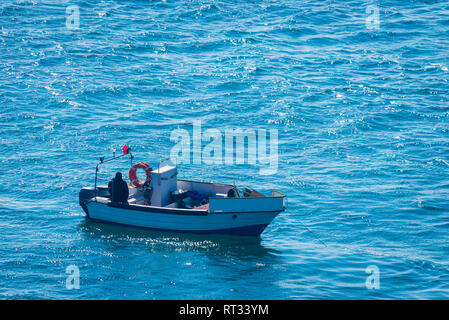 Boat racing across open ocean water. Boat speeding in the sea. Minimal nature photography. Beach view of maritime transportation. Minimal abstract nat Stock Photo