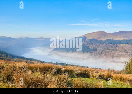 A cloud inversion over the Talybont Reservoir on a bright sunny morning in February, The Brecon Beacons National Park, Wales, UK Stock Photo
