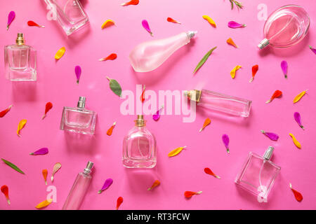 Perfume bottles with the flower petals background Stock Photo