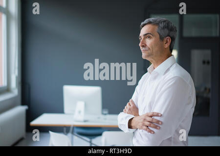 Businessman in the office thinking Stock Photo
