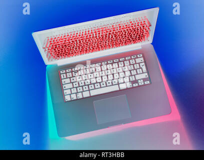 Laptop being attacked by a hacker Stock Photo