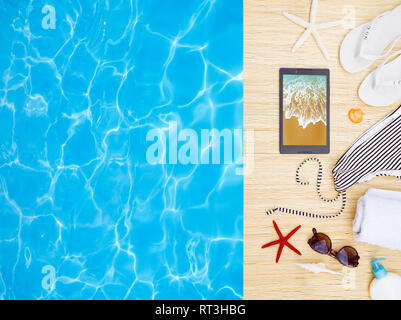 Woman's beach accessories with a tablet Stock Photo