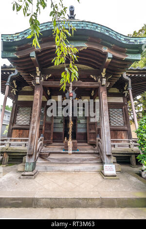 Yanaka, Tokyo, Japan - August 18, 2017 : Shrine housing wooden Bishamonten statue at Tennoji Temple of Tendai sect of Buddhism. Founded in 1274, locat Stock Photo