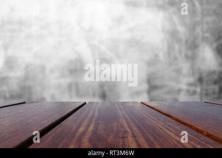 Wood Table Top and concrete wall Background. Stock Photo