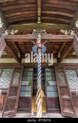 Yanaka, Tokyo, Japan - August 18, 2017 : Shrine housing wooden Bishamonten statue at Tennoji Temple of Tendai sect of Buddhism. Founded in 1274, locat Stock Photo