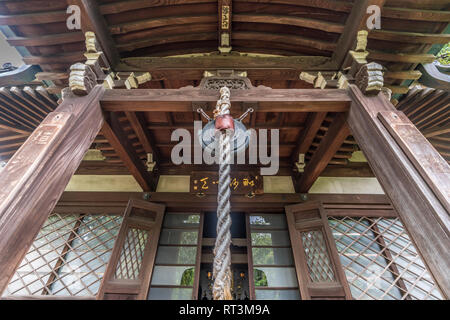 Yanaka, Tokyo, Japan - August 18, 2017 : Shrine housing wooden Bishamonten statue at Tennoji Temple of Tendai sect of Buddhism. Founded in 1274, locat Stock Photo