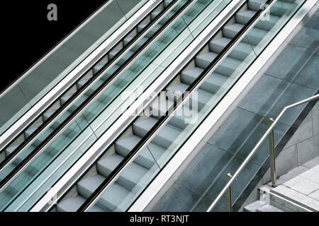 Two parallel automatic escalators from side view Stock Photo