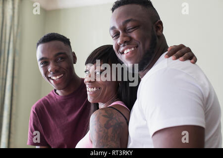 Portrait happy mother and teenage sons Stock Photo