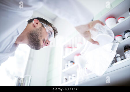 Man working in laboratory of a pharmacy Stock Photo