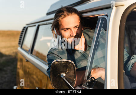 Young man on a road trip with his camper Stock Photo