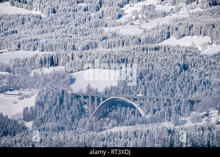 View from Pack to bridge of autobahn A2 in a snow covered wonderland in carinthia in Austria Stock Photo