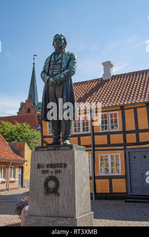 Statue of the Danish physicist and chemist Hans Christian Oersted - Ørsted. He discovered that electricity and magnetism are linked. In front of half  Stock Photo