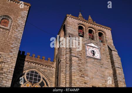 Down to up view of bell tower and facade of medieval cathedral Stock Photo