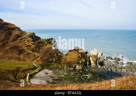 The South West Coast Path and Tarka Trail and rocky cove near Lee Bay, Ilfracombe North Devon, England, UK, Britain Stock Photo