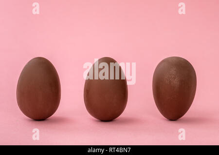 funny creative concept of Easter eggs on pink background, copy space Stock Photo
