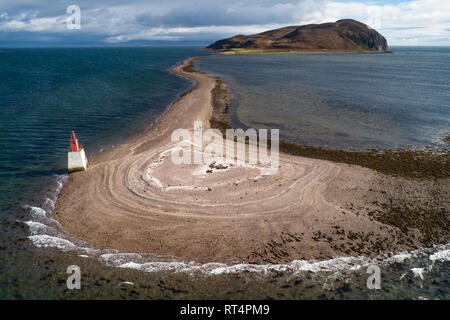 Aerial image showing Davaar Island and The Doirlinn, a shingle penisula which joins it to the mainland, in dramatic light. Stock Photo