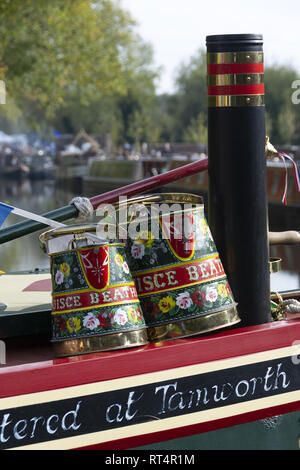 Hand painted water jugs on top of narrowboat Stock Photo