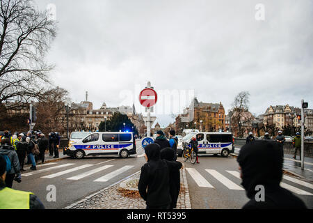 STRASBOURG, FRANCE - DEC 8, 2018: Police surveilling the entrance to Strasbourg Christmas Market in Strasbourg during winter holiday - city center surveillance Stock Photo