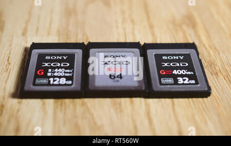 PARIS, FRANCE - MAR 26, 2017: Three generations of Sony XQD M, G, G 2 data memory card made by SONY used in Nikon and Sony video photo products for high speed storage of content Stock Photo