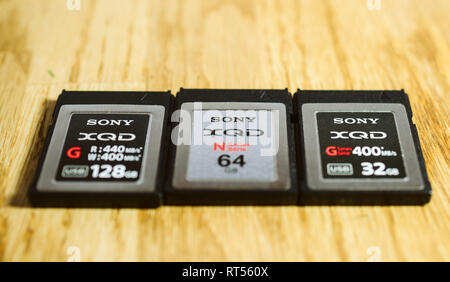 PARIS, FRANCE - MAR 26, 2017: Three generations of Sony XQD M, G, G 2 data memory card made by SONY used in Nikon and Sony video photo products for high speed storage of content Stock Photo