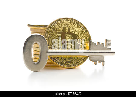 Bitcoin and safe key isolated on white background. Stock Photo