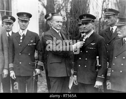 U.S. President Calvin Coolidge conferring the Congressional Medal Of Honor to Floyd Bennett and Richard Byrd. Stock Photo