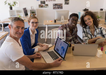 Business colleagues working together in office Stock Photo