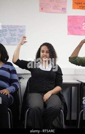 adults in a further education college learning how to use sign language Stock Photo