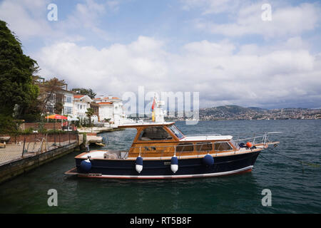 Small private yacht at anchor on the Bosphorus strait, Istanbul, Turkey Stock Photo