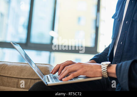 Close up man using laptop Stock Photo