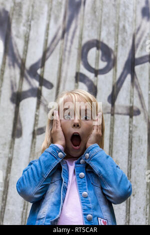 Portrait of scared blond girl Stock Photo