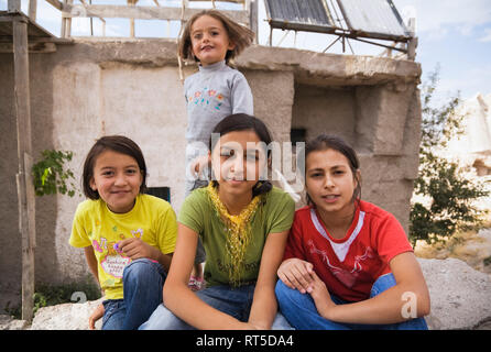 Young turkish girls smiling for the camera, Uchisar village, Cappadocia region, Turkey Stock Photo