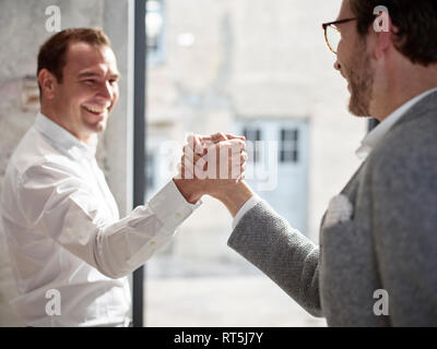 Two happy businessmen shaking hands Stock Photo