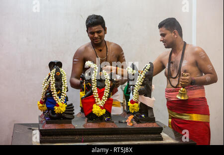 Hindu Temple, Sri Maha Mariamman, Priests Decorating Deity Statues during Navarathri Celebrations, George Town, Penang, Malaysia. Stock Photo