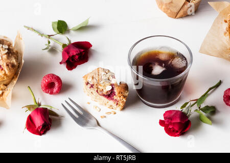 Raspberry muffin and glass of iced coffee Stock Photo