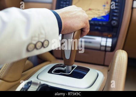 Hand of a businessman on the gearshift Stock Photo