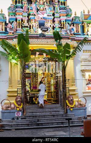 Worshiper Entering Hindu Temple, Sri Maha Mariamman, George Town, Penang, Malaysia. Stock Photo