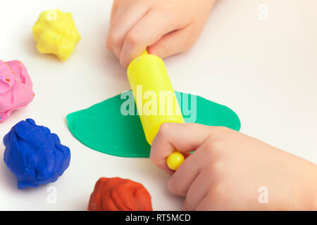 Child Playing Playdough. Close up. Stock Photo