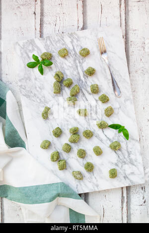 Spinach basil gnocchi on marble Stock Photo