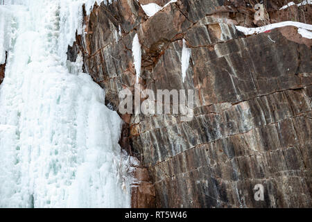 Background from brown granite with wrinkles. The texture of the raw stone. Stock Photo
