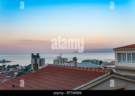 scarlet sunset over the sea view from the window Stock Photo