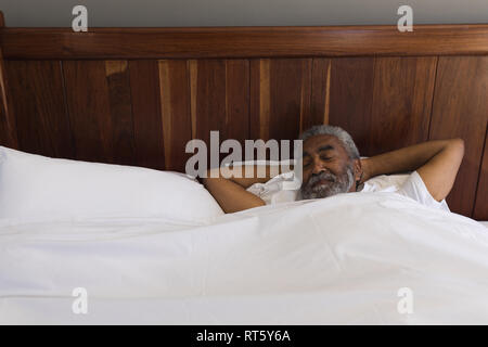 Senior man sleeping in bedroom at home Stock Photo