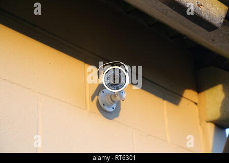 Security camera mounted on wall Stock Photo