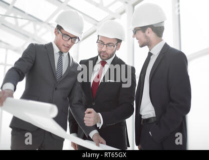 businessman asks questions to the chief architect Stock Photo