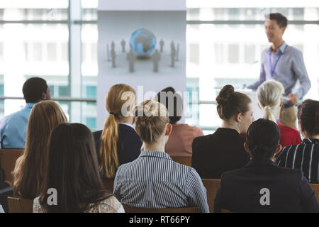 Group of business people attending seminar Stock Photo
