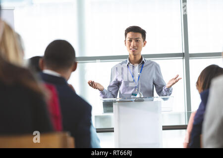 Young Asian businessman speaks at a business seminar Stock Photo