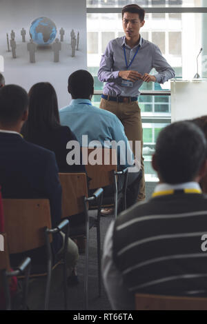 Young male speaker speaks in a business seminar Stock Photo