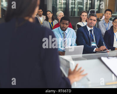 Group of business people attending a seminar Stock Photo